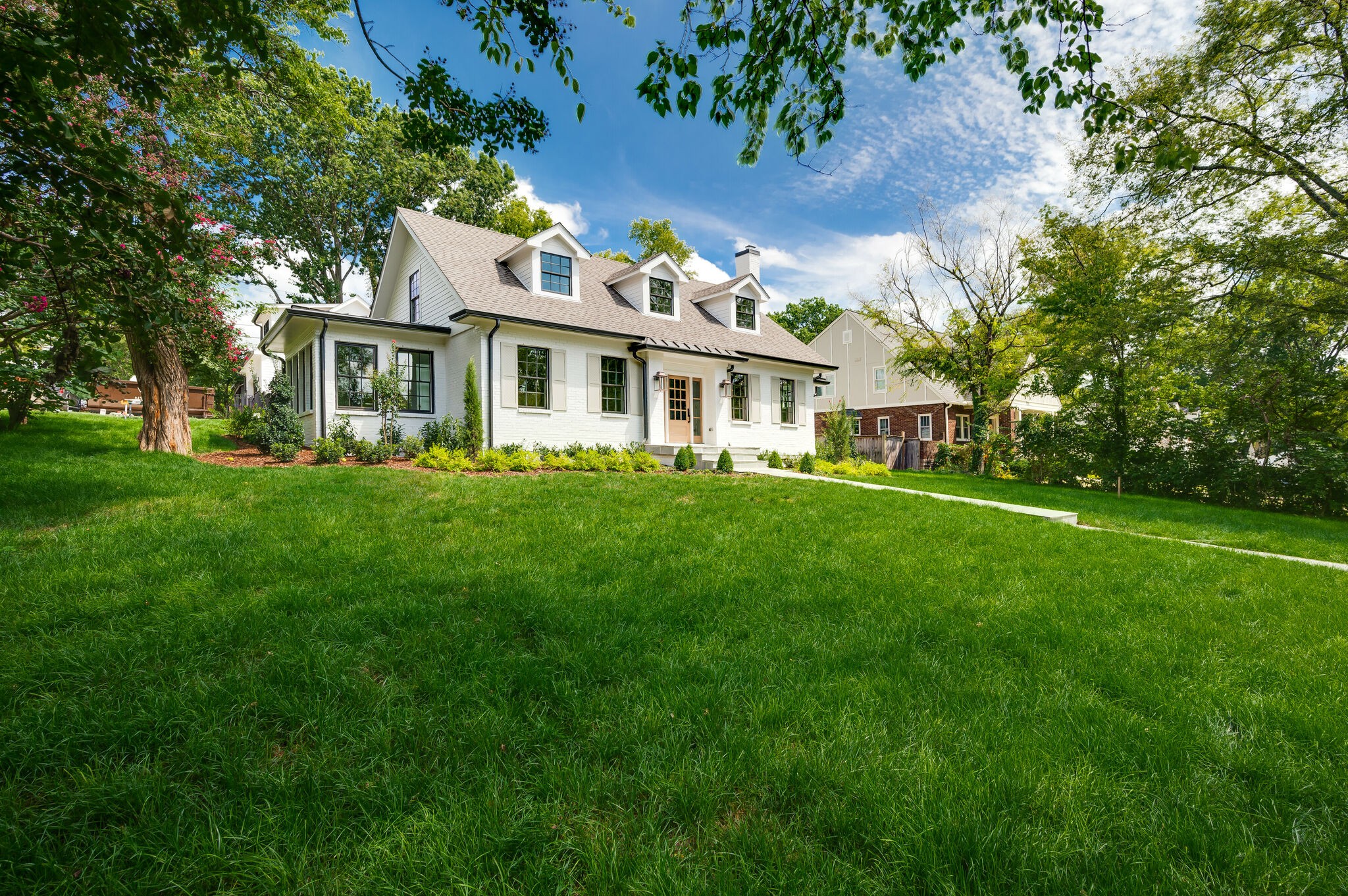 1818 Cedar Lane Nashville, TN 37212 - Photo 3 of 70 a front view of a house with a garden