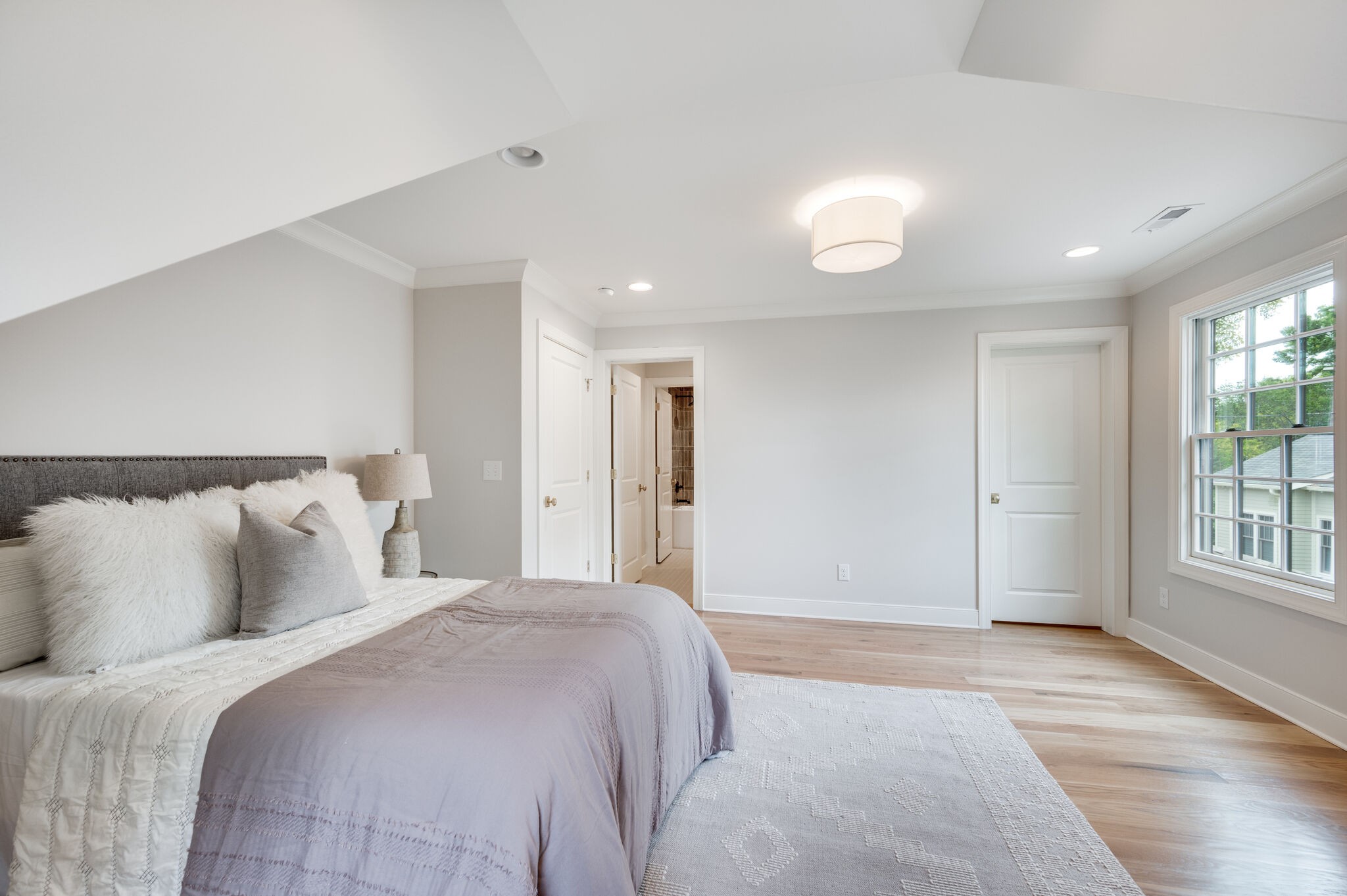 1818 Cedar Lane Nashville, TN 37212 - Photo 50 of 70 a bedroom with a large bed and a window