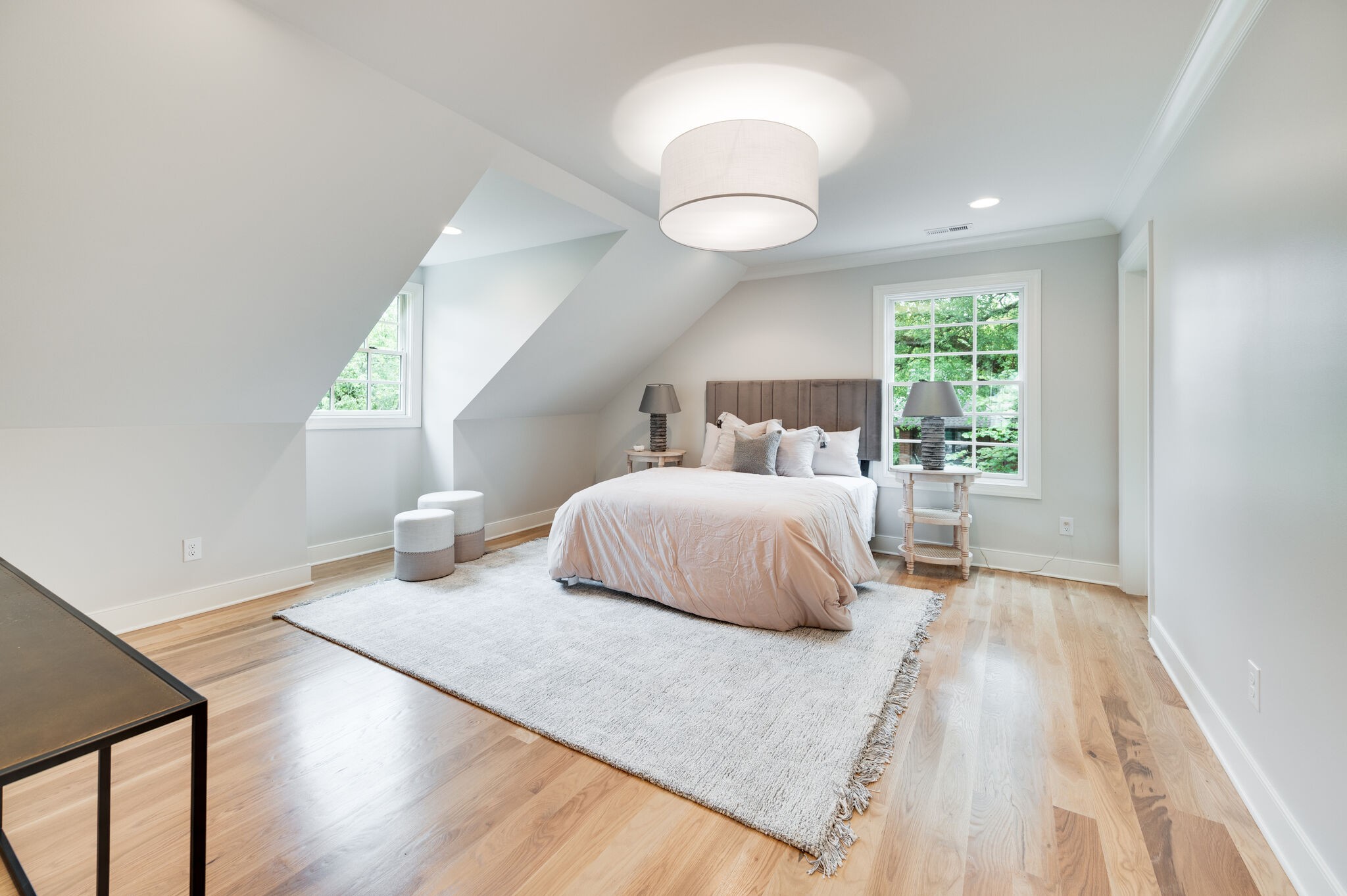 1818 Cedar Lane Nashville, TN 37212 - Photo 54 of 70 a bedroom with a large bed and a chandelier