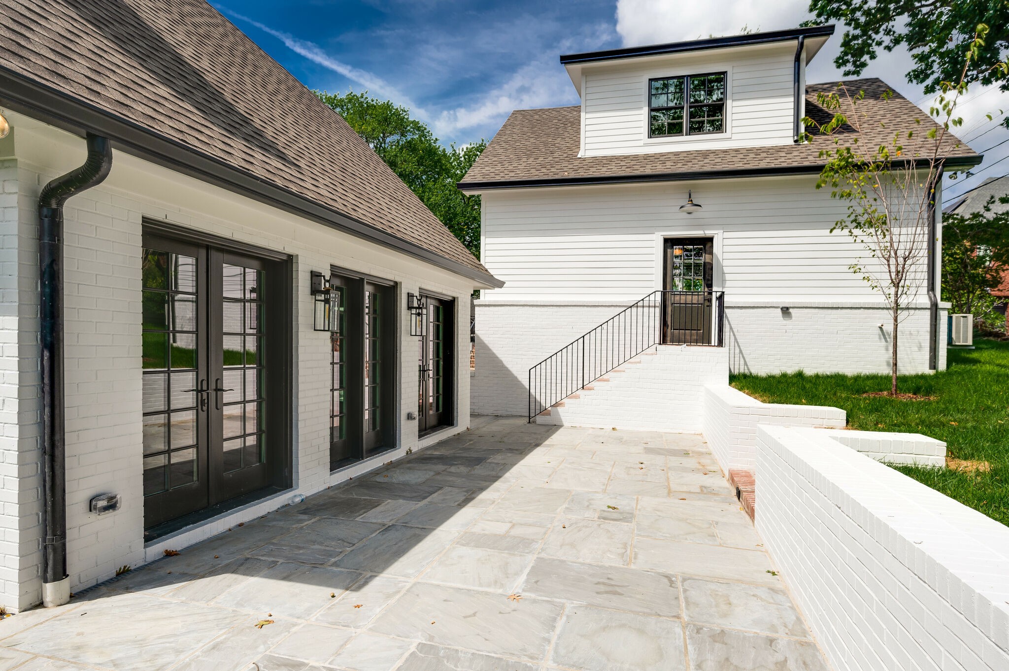 1818 Cedar Lane Nashville, TN 37212 - Photo 64 of 70 a view of a white house with many windows