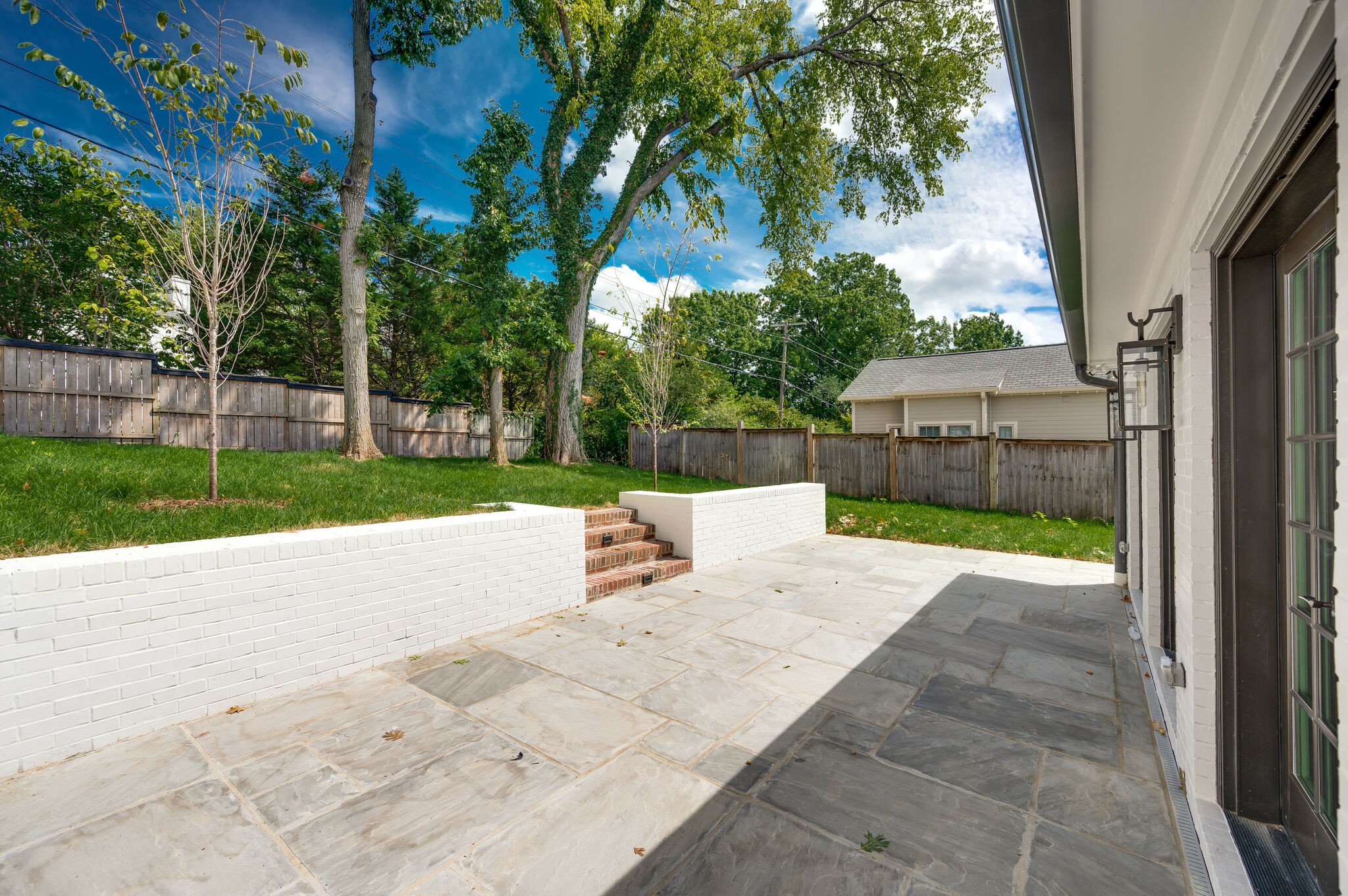 1818 Cedar Lane Nashville, TN 37212 - Photo 66 of 70 a view of a backyard with a garden and trees