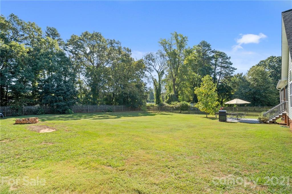 638 Maple Ridge Circle Salisbury, NC 28147 - Photo 12 of 48 a view of a swimming pool with an outdoor space and seating area