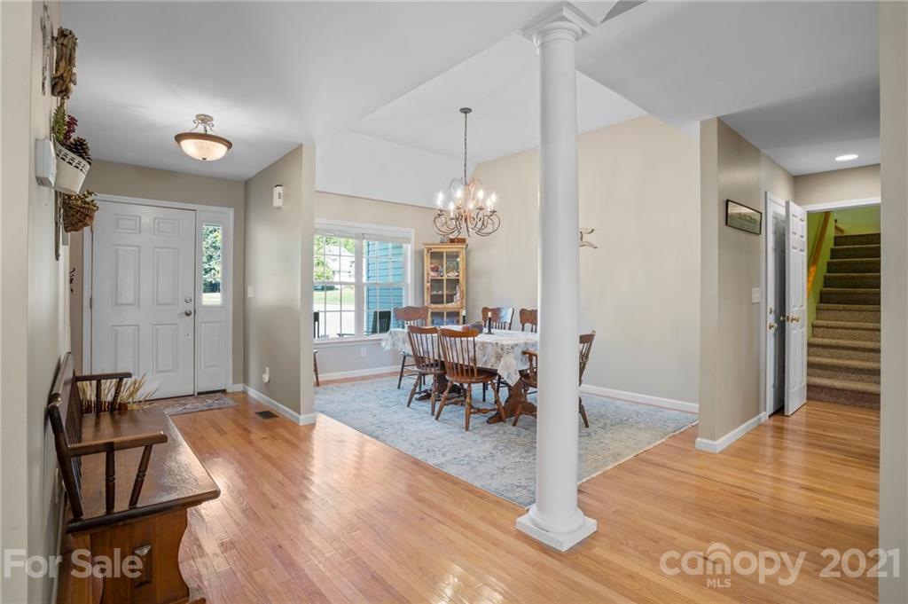 638 Maple Ridge Circle Salisbury, NC 28147 - Photo 19 of 48 a view of a a dining room with furniture window and wooden floor