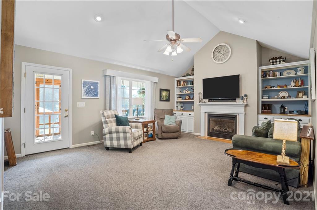 638 Maple Ridge Circle Salisbury, NC 28147 - Photo 22 of 48 a living room with furniture and a fireplace