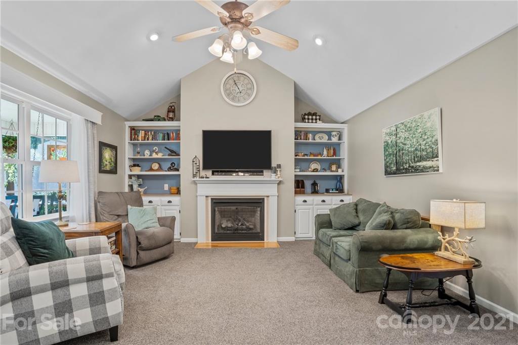 638 Maple Ridge Circle Salisbury, NC 28147 - Photo 24 of 48 a living room with furniture a flat screen tv and a fireplace