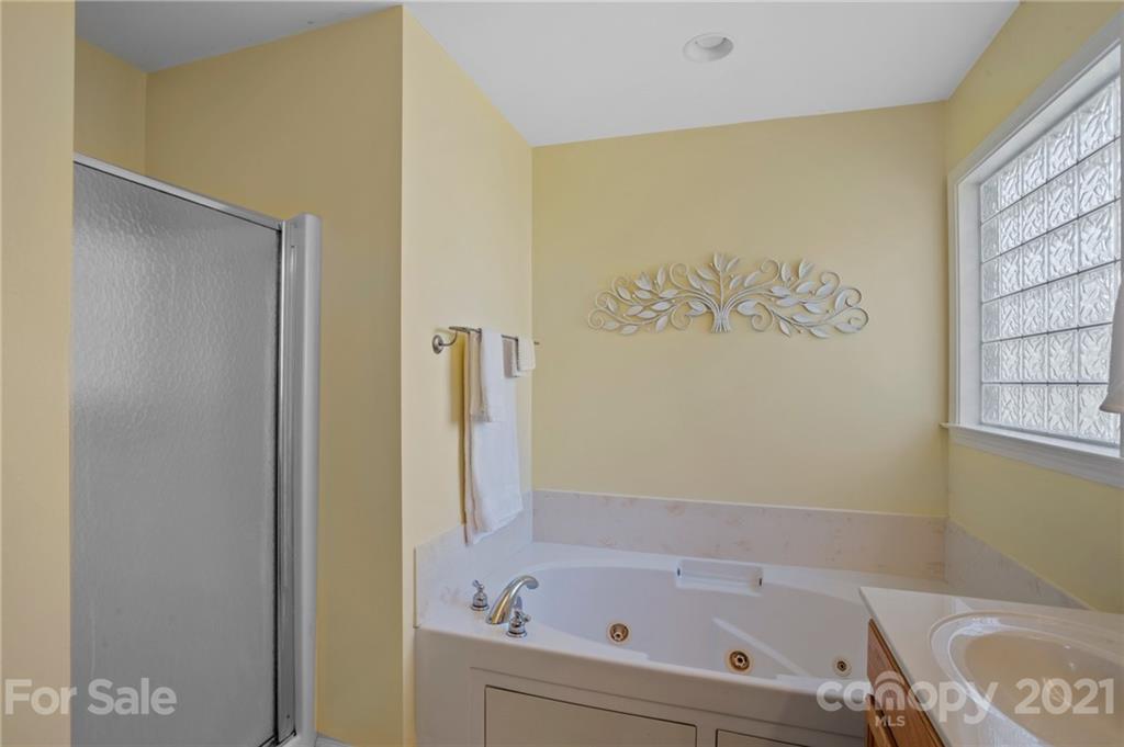 638 Maple Ridge Circle Salisbury, NC 28147 - Photo 32 of 48 a bathroom with a bathtub and a shower