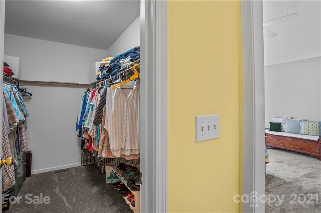 638 Maple Ridge Circle Salisbury, NC 28147 - Photo 33 of 48 a view of walk in closet with clothes and shoes
