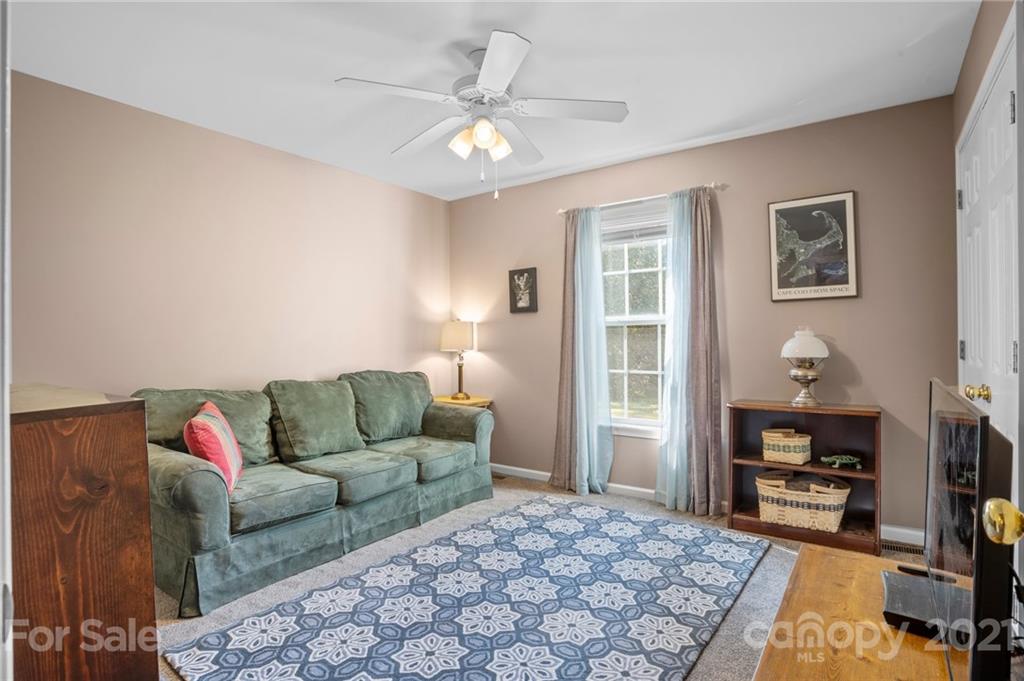 638 Maple Ridge Circle Salisbury, NC 28147 - Photo 35 of 48 a living room with furniture and a flat screen tv