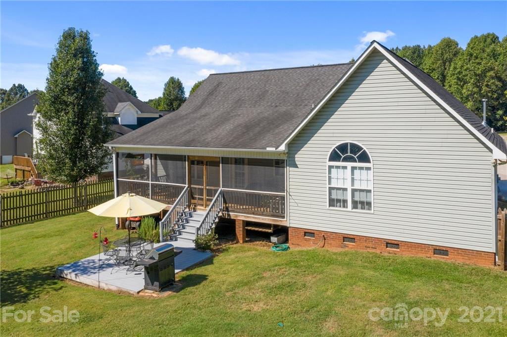 638 Maple Ridge Circle Salisbury, NC 28147 - Photo 47 of 48 a view of a house with pool and chairs