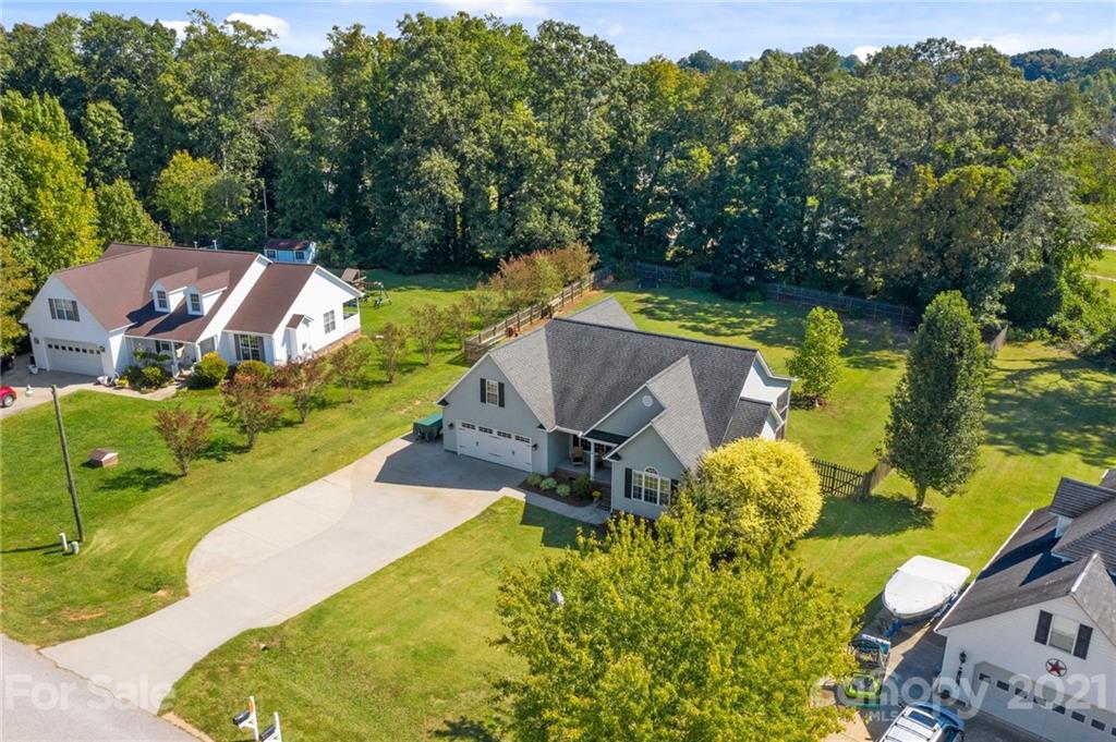 638 Maple Ridge Circle Salisbury, NC 28147 - Photo 48 of 48 an aerial view of a house with swimming pool a yard and lake view