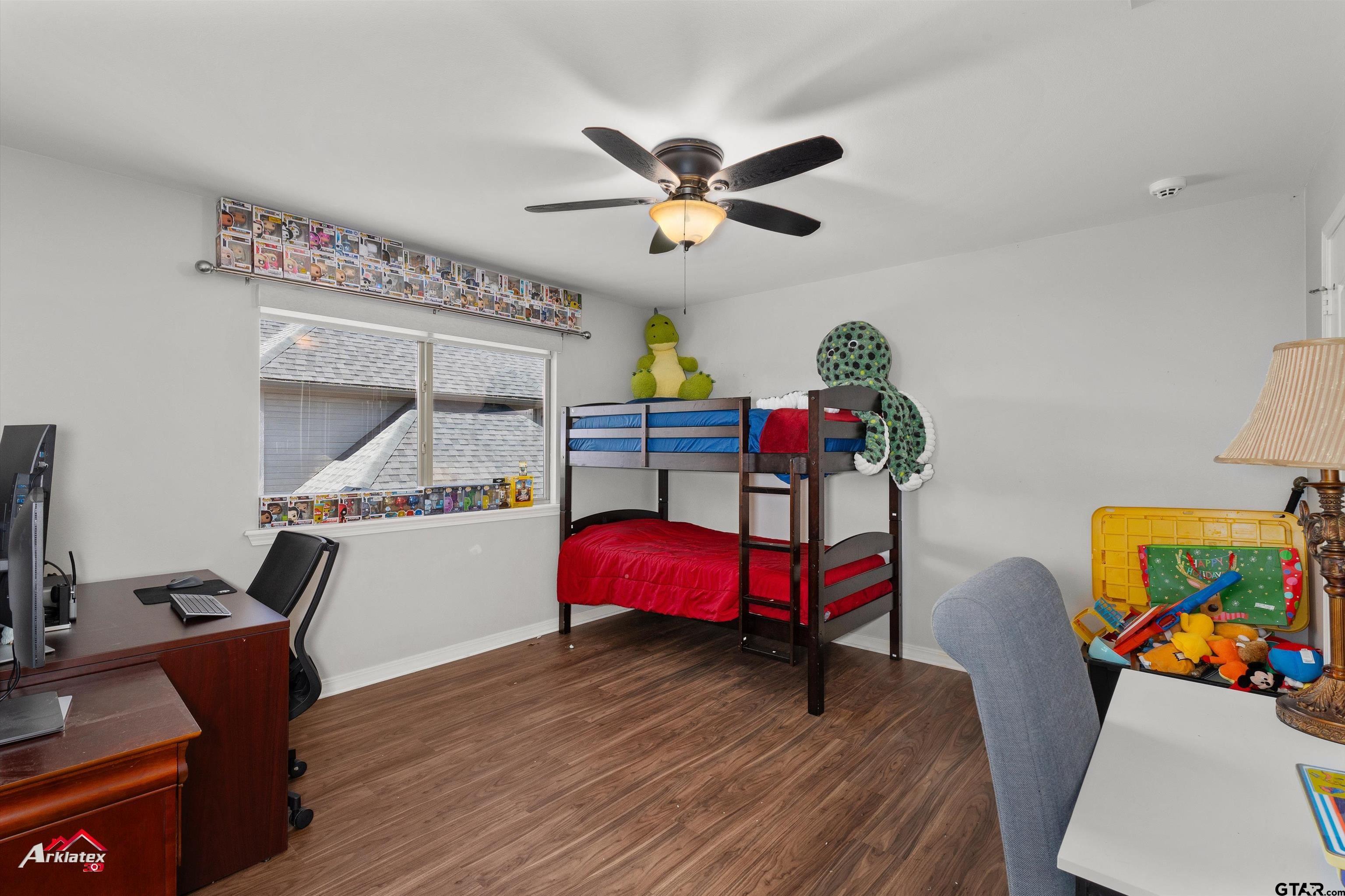 3815 Holly Ridge Drive Longview, TX 75605 - Photo 17 of 22 a living room with furniture and a wooden floor