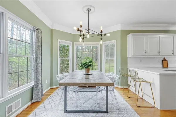 a view of a dining room with furniture window and outside view
