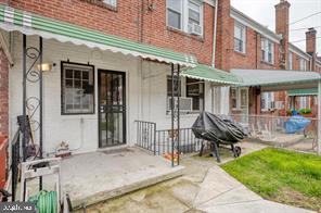 1618 Roundhill Road Baltimore, MD 21218 - Photo 42 of 50 a backyard of a house with table and chairs