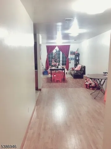 a bedroom with a bed and curtain