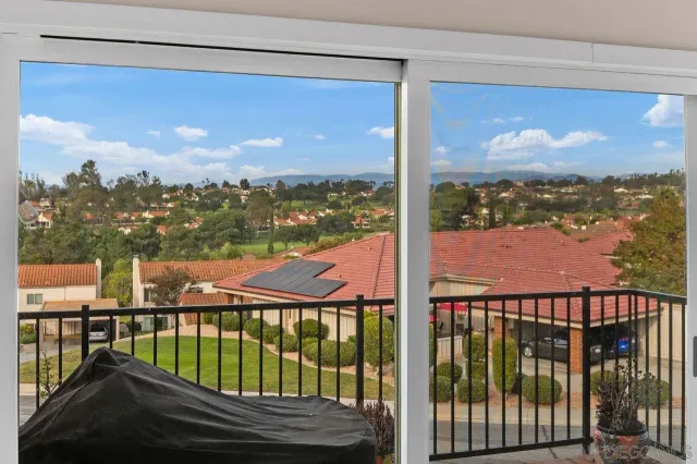 a living room with furniture and windows
