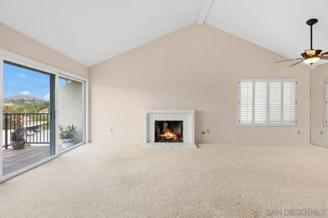 a kitchen with white cabinets and appliances