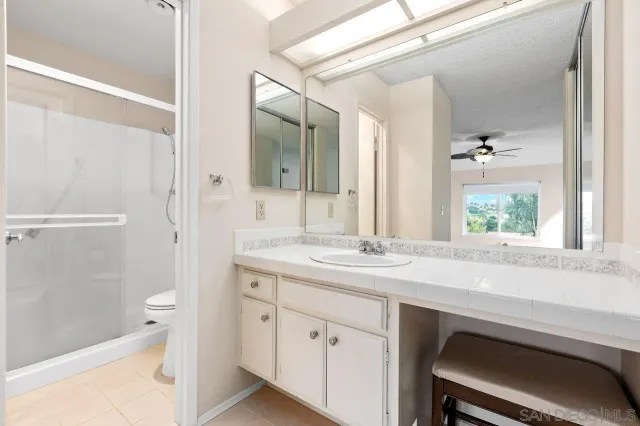 a bathroom with a shower and a toilet