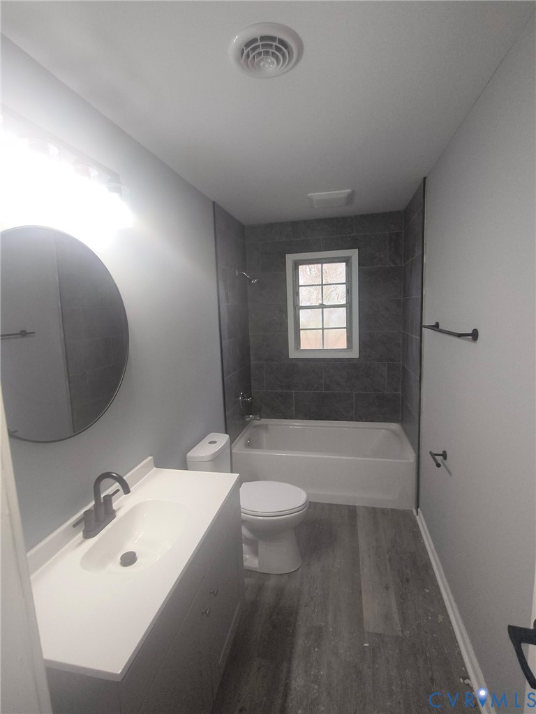 2211 Johnson Street Hopewell, VA 23860 - Photo 6 of 8 a bathroom with a sink a toilet and bathtub