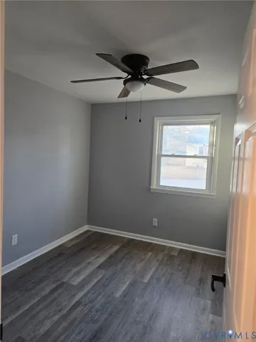 a view of room with window and ceiling fan