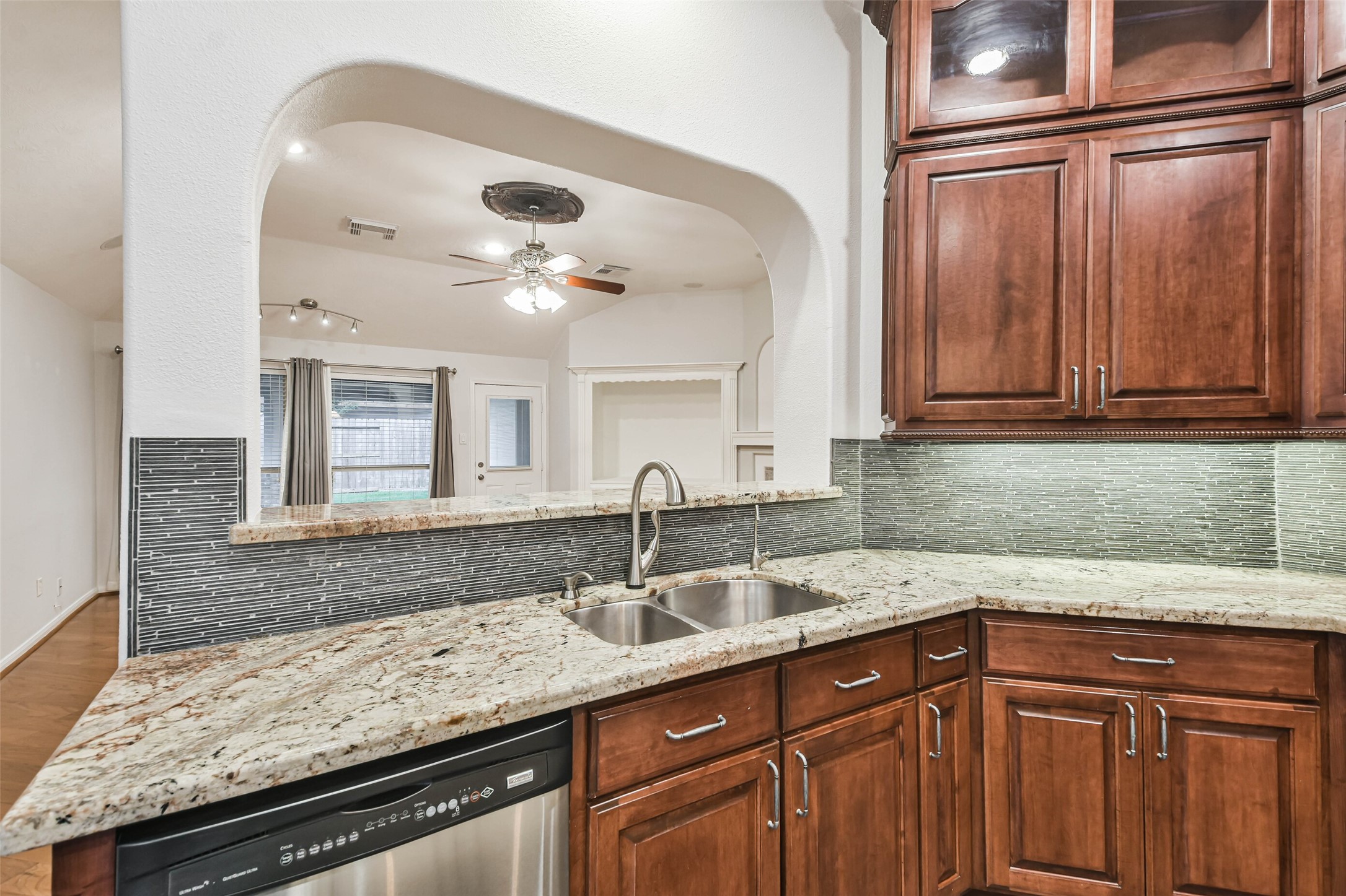 20942 Wind Field Lane Spring, TX 77379 - Photo 11 of 46 a kitchen with granite countertop a sink and cabinets