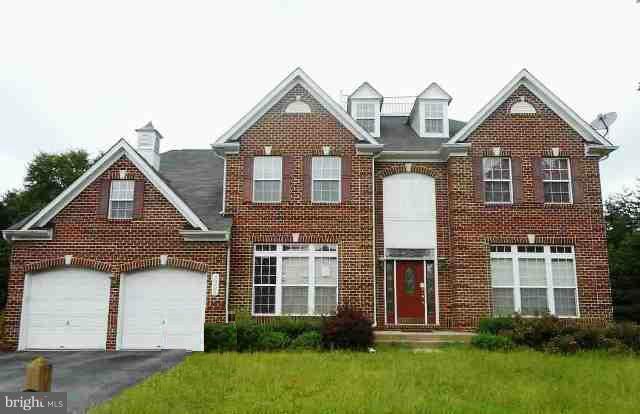 9906 Farm Pond Road Laurel, MD 20708 - Photo 1 of 11 front view of a house with a yard