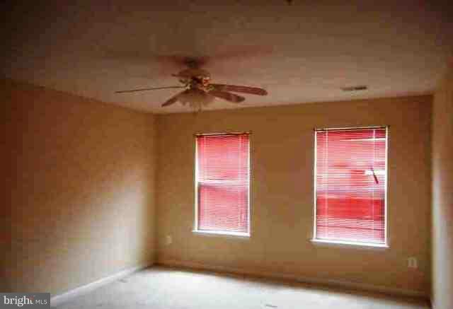 9906 Farm Pond Road Laurel, MD 20708 - Photo 9 of 11 a view of windows and chandelier