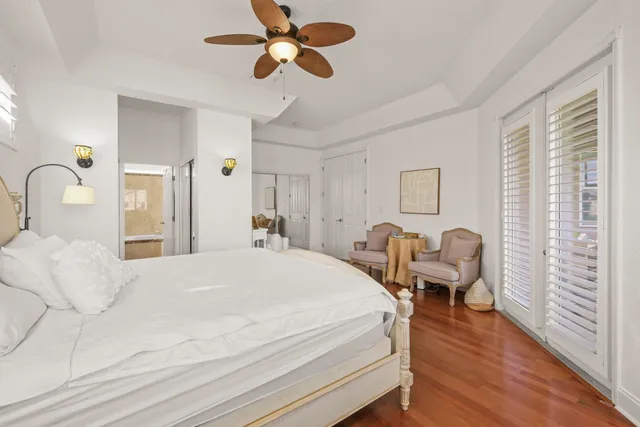 a bedroom with a bed couch and a window