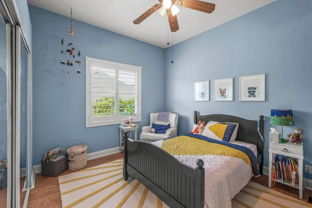 a bedroom with bed and a window