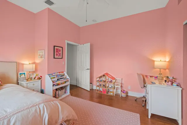 a bed room with a bed and a dresser