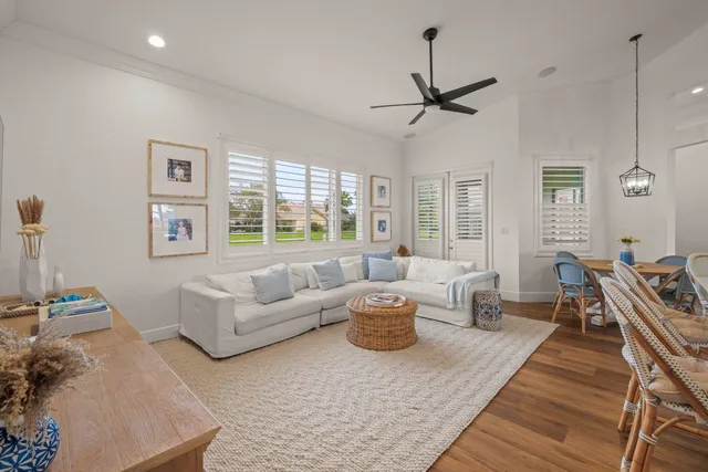 a living room with furniture or couch and a wooden floor