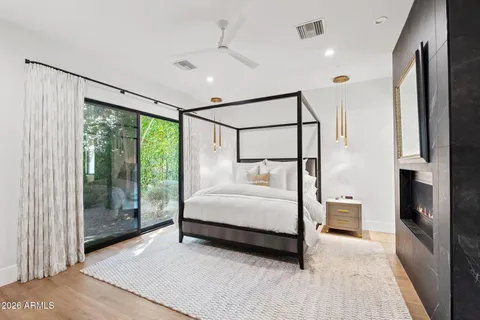 a bedroom with a large bed and a window