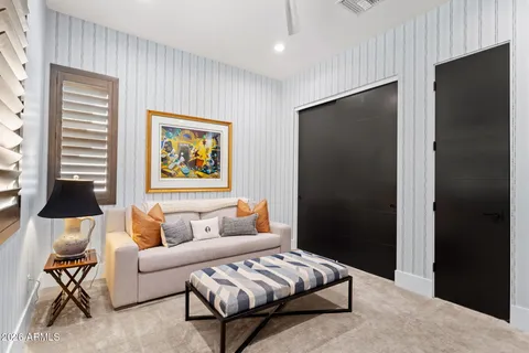 a bedroom with a bed and a fireplace