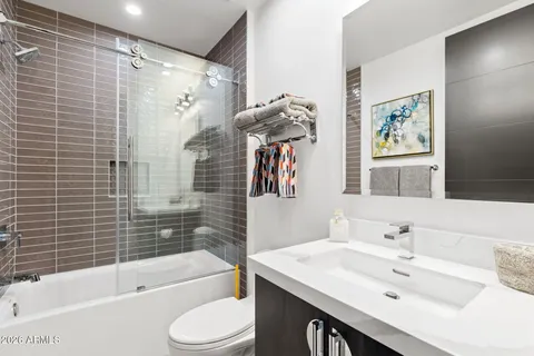 a kitchen with a stove a sink and a cabinets