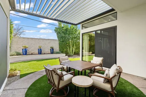 a swimming pool with chairs