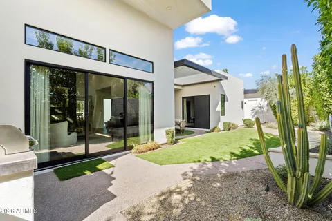 a view of a house with a yard and garage