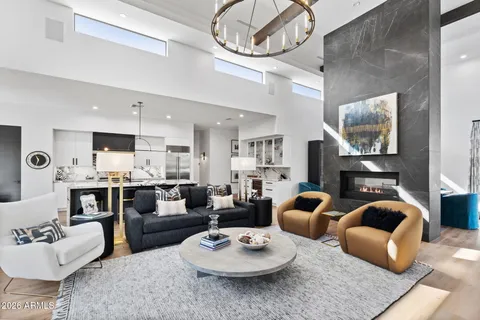 a living room with furniture a rug and a flat screen tv