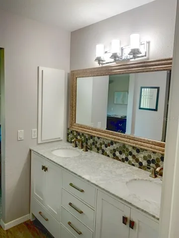 a bathroom with a sink and a mirror