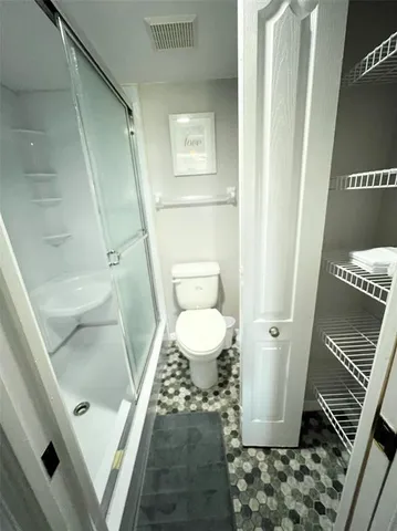 a bathroom with a sink and toilet