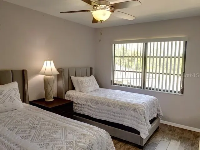 a bedroom with bed and a window