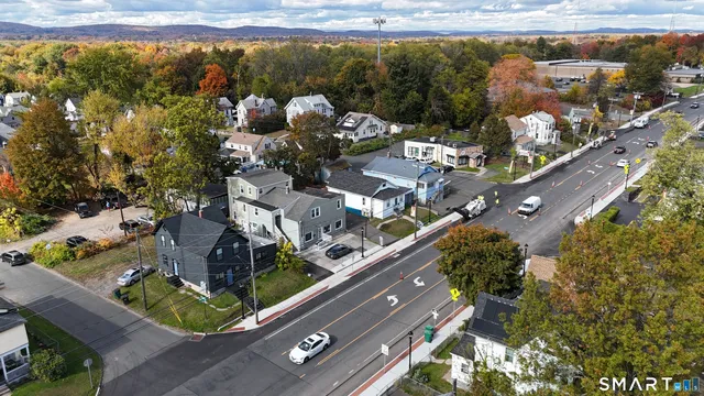 an aerial view of a residential houses with outdoor space