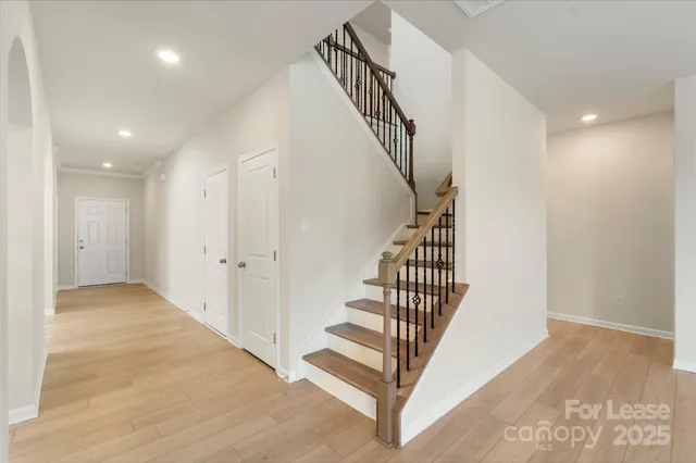 a view of a hallway with staircase