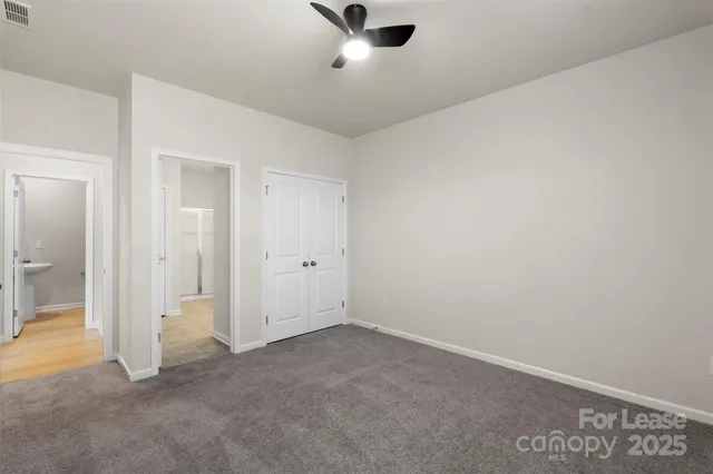 an empty room with closet area