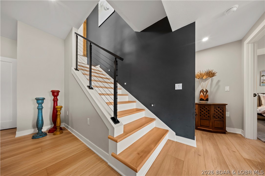 1151 Oak Road Osage Beach, MO 65065 - Photo 33 of 63 Lower-level gathering area with modern staircase a