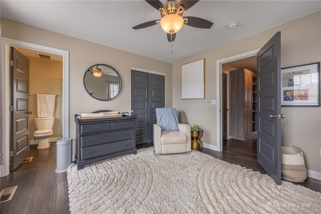 407 Brownstone Row Springboro, OH 45066 - Photo 35 of 54 This inviting room features elegant dark wood flooring.