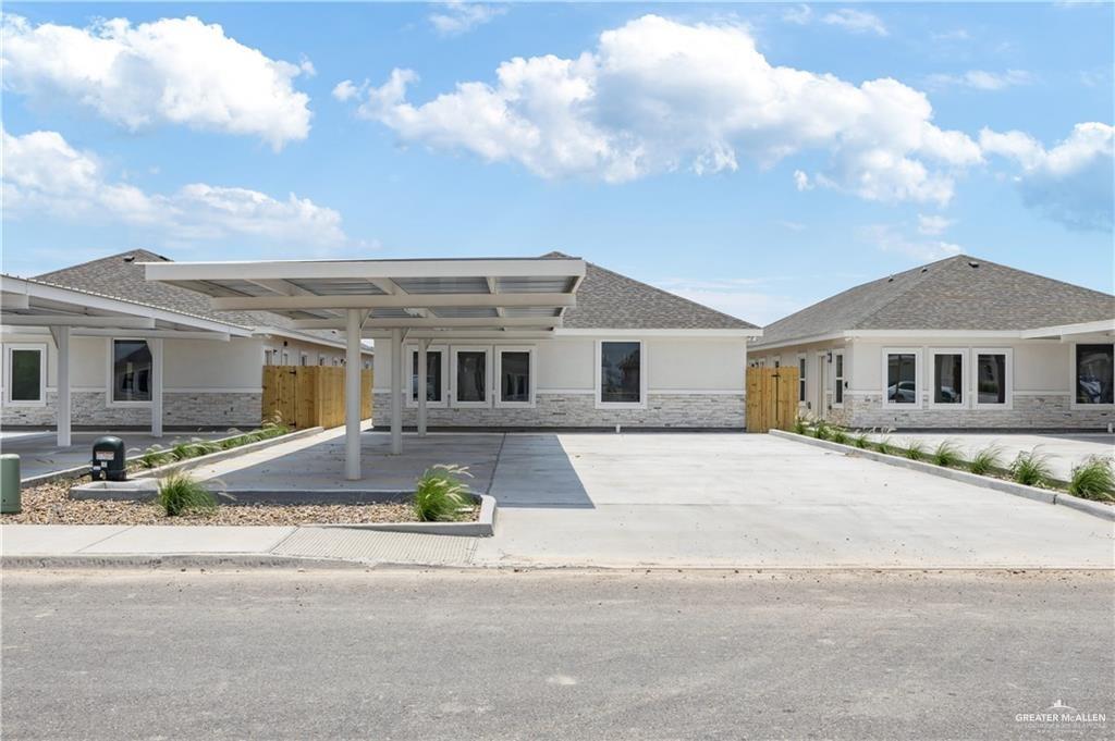 5323 Vision Street, Unit A Rio Grande City, TX 78582 - Photo 1 of 13 front view of a house with a street