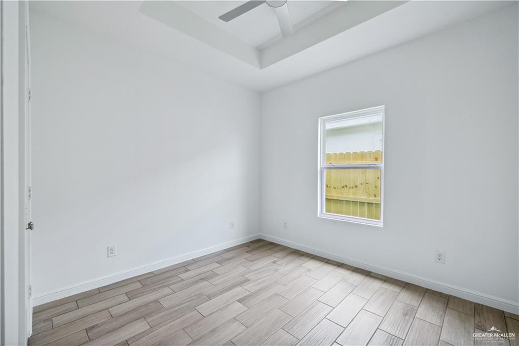 5323 Vision Street, Unit A Rio Grande City, TX 78582 - Photo 6 of 13 an empty room with a window