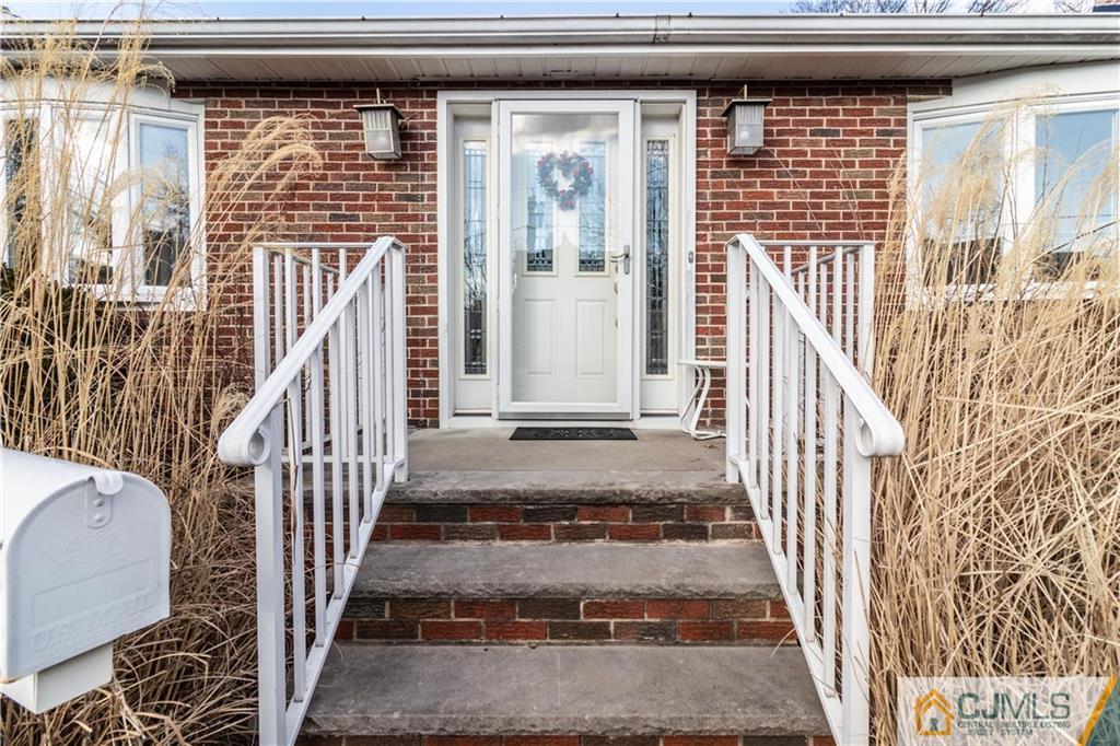 50 Enfield Road Colonia, NJ 07067 - Photo 3 of 31 a view of a house with wooden door and windows