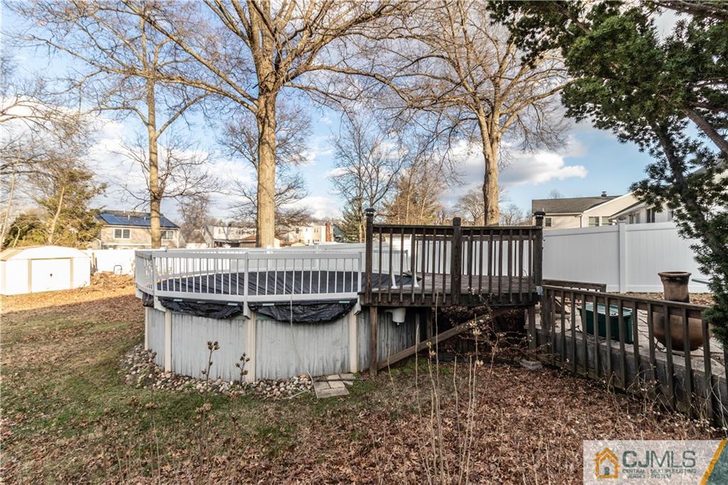 50 Enfield Road Colonia, NJ 07067 - Photo 8 of 31 a view of a roof deck with wooden fence and floor chairs