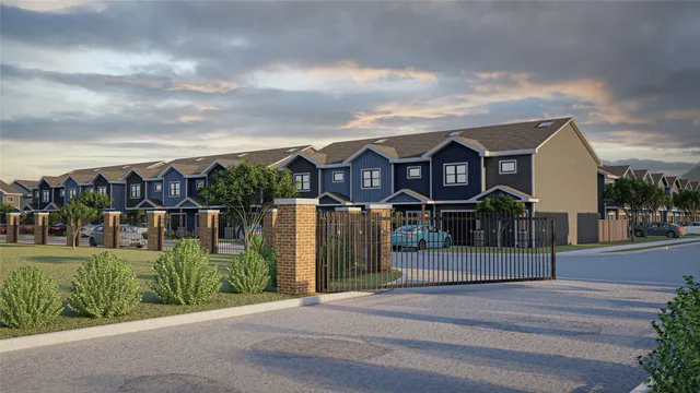 a view of multiple houses with a yard