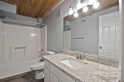 201 South Hoskins Road, Unit 111 Charlotte, NC 28208 - Photo 12 of 16 a bathroom with a granite countertop sink toilet and shower